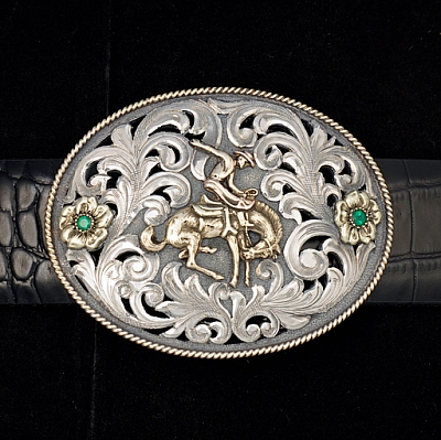 BROOKS 1818 STERLING SILVER FILIGREE BUCKLE WITH 14K THREE COLOR BRONC, 14K GREEN GOLD FLOWERS, 14K YELLOW GOLD ROPE EDGE;  4MM EMERALDS.